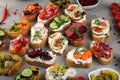 Assorted bruschetta with various toppings. Appetizing bruschetta or brie crostini. Variety of small sandwiches. Mix bruschetta on Royalty Free Stock Photo