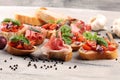 Assorted bruschetta with various toppings. Appetizing bruschetta or crudo crostini. Variety of small sandwiches. Mix bruschetta on Royalty Free Stock Photo