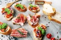 Assorted bruschetta with various toppings. Appetizing bruschetta or crudo crostini. Variety of small sandwiches. Mix bruschetta on Royalty Free Stock Photo