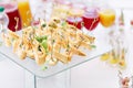 Assorted canape with cheese, meat, rolls, tortilla and fruit salad. Food to accompany the drinks. the buffet at the Royalty Free Stock Photo