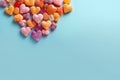 Assorted Candy Heart Shapes on Light Banner: Sweet Valentine\'s Day Treats.