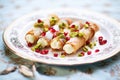 assorted cannoli with pistachios and cherries