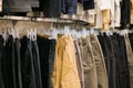 Assorted casual pants hanging in retail store display Royalty Free Stock Photo