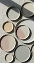 Assorted ceramic plates arranged on a textured, off-white fabric. The plates feature Royalty Free Stock Photo