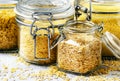 Assorted cereals and grains in glass jars for storage, selective Royalty Free Stock Photo