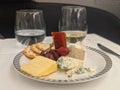 Assorted Cheese, crackers and grapes on serving luxury beautiful plate. Royalty Free Stock Photo