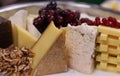 Assorted cheese platter in a table Royalty Free Stock Photo