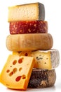 Assorted cheese selection arranged neatly on white background for culinary display Royalty Free Stock Photo