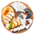 Assorted cheese on wooden board