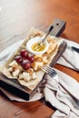 Appetizer bruschetta with honey, hazelnuts and cottage cheese