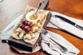 Appetizer bruschetta with honey, hazelnuts and cottage cheese