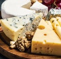 Assorted cheeses with mold, Maasdam, Roquefort, brie and others Royalty Free Stock Photo