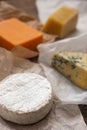 Assorted cheeses on the wooden table