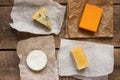 Assorted cheeses on the wooden table Royalty Free Stock Photo
