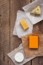 Assorted cheeses on the wooden table Royalty Free Stock Photo