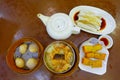 Assorted Chinese food set, dumplings, and rice noodle rolls, famous Chinese cuisine dishes on a wooden table, top view. Chinese re Royalty Free Stock Photo