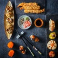 Assorted Chinese japanese food set. Gyoza dumplings, xiao long bao, shao mai, gunkan, fried takoyaki, Deep Fried shrimp prawn Royalty Free Stock Photo