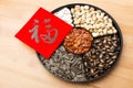 Assorted chinese sytle snack tray and chinese calligraphy, meaning for blessing good luck Royalty Free Stock Photo