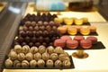 Assorted chocolate candies in a pastry shop, close-up. Royalty Free Stock Photo