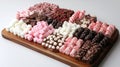 Assorted Chocolate Covered Marshmallows and Candies on a Wooden Serving Board Royalty Free Stock Photo