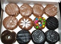 Assorted Chocolate donuts isolated in a white box