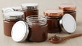 Assorted Chocolate Hazelnut Spread Jars with Silver and Bronze Metallic Lids Royalty Free Stock Photo