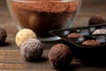 Assorted chocolates. candies of different types of chocolate on a brown wooden table Royalty Free Stock Photo