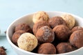 Assorted chocolates. candy balls of different types of chocolate on a blue wooden table. close-up Royalty Free Stock Photo