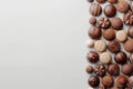 Assorted chocolates display with ample copy space on clean background for text or branding placement