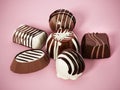 Assorted chocolates on pink background. 3D illustration Royalty Free Stock Photo