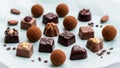 Assorted chocolates and truffles are arranged on a light blue Royalty Free Stock Photo