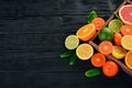 Assorted citrus fruit in a wooden box. Orange, tangerine, grapefruit, lemon. On a wooden background. Royalty Free Stock Photo