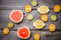 Assorted citrus fruit in a wooden box. Orange, tangerine, grapefruit, lemon. On a wooden background. Top view. Copy space Royalty Free Stock Photo