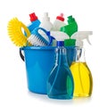 Assorted cleaning tools and solutions arranged in a blue bucket and bottles Royalty Free Stock Photo