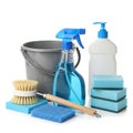 Assorted cleaning tools and supplies arranged neatly on a white surface Royalty Free Stock Photo