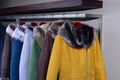 Assorted coats hanging on shop rack Royalty Free Stock Photo