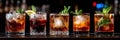 Assorted cocktails with garnishes on bar countertop Royalty Free Stock Photo