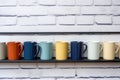 assorted coffee mugs hanging on the kitchen wall Royalty Free Stock Photo
