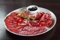 Assorted cold meat deli plate at the restaurant Royalty Free Stock Photo