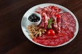 Assorted cold meat deli plate at the restaurant Royalty Free Stock Photo