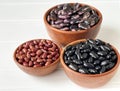 assorted colored beans in brown bowls Royalty Free Stock Photo