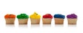 Assorted colored Cupcakes with sprinkles on white Royalty Free Stock Photo