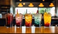 Assorted Colored Drinks on Wooden Table Royalty Free Stock Photo