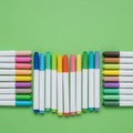 Assorted colored markers with white barrels are arranged on a Royalty Free Stock Photo