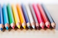 Assorted colored pencils in a row, closeup, School supplies. Royalty Free Stock Photo