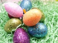 nest of green grass, sparkly, bright, colorful Easter eggs Royalty Free Stock Photo