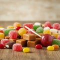 Assorted Colorful Candies and Caramel on Wooden Table Royalty Free Stock Photo