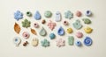 Assorted colorful ceramic objects are arranged on a light background. The items Royalty Free Stock Photo