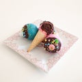 Assorted colorful cupcakes in ice cream cones Royalty Free Stock Photo