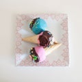 Assorted colorful cupcakes in ice cream cones Royalty Free Stock Photo